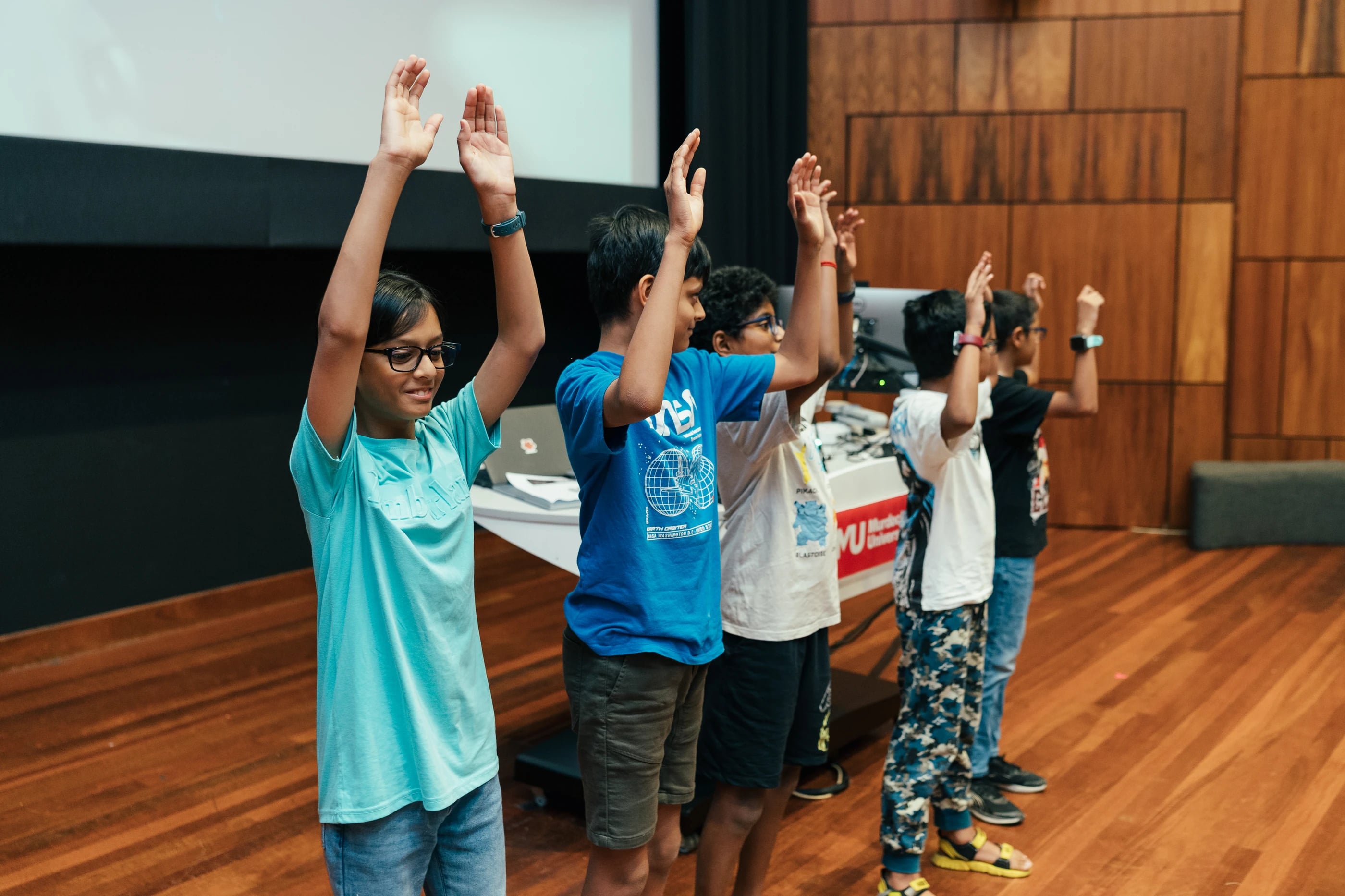 Students volunteering in a group activity