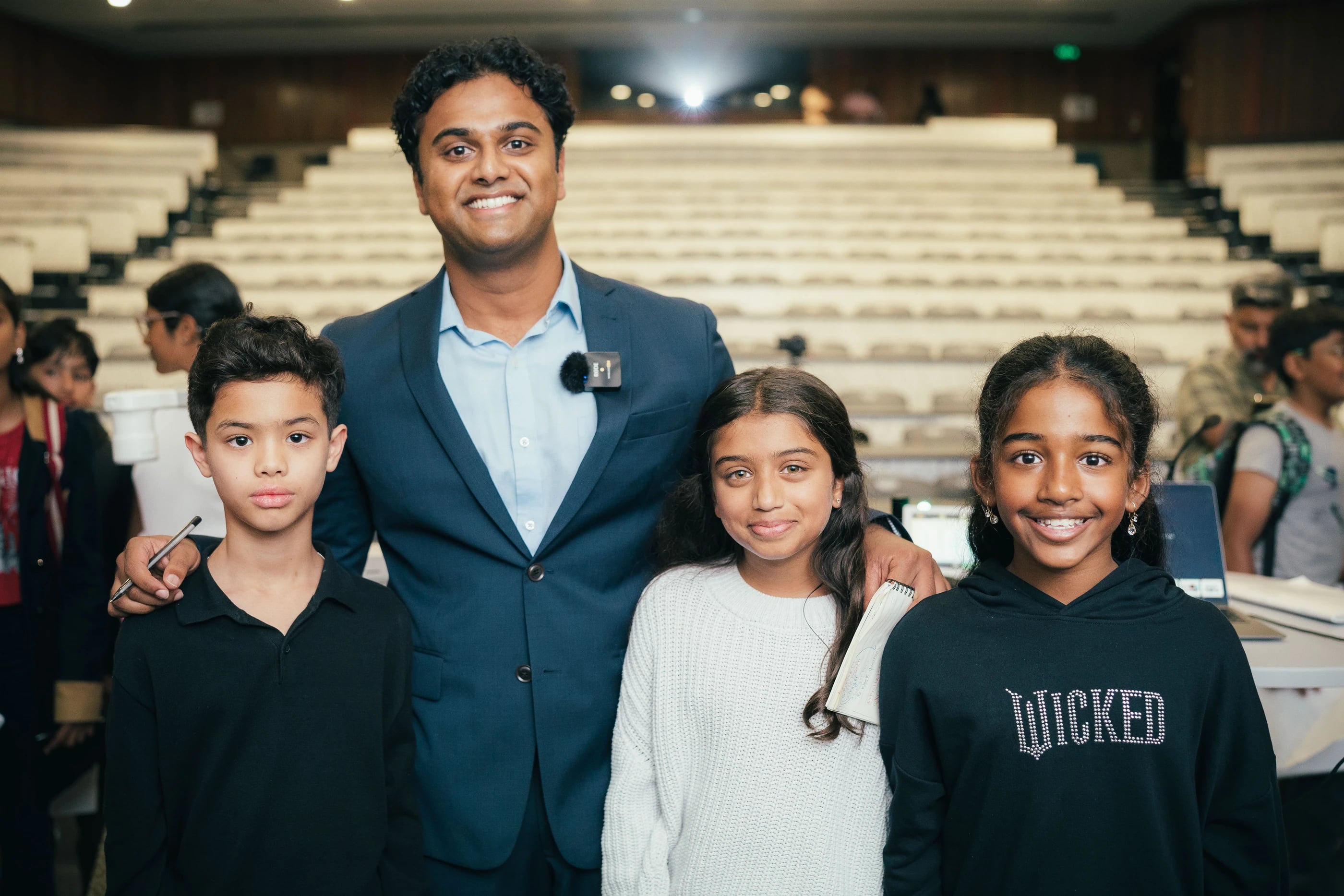 An educator and three students at the 2025 Loyola masterclass
