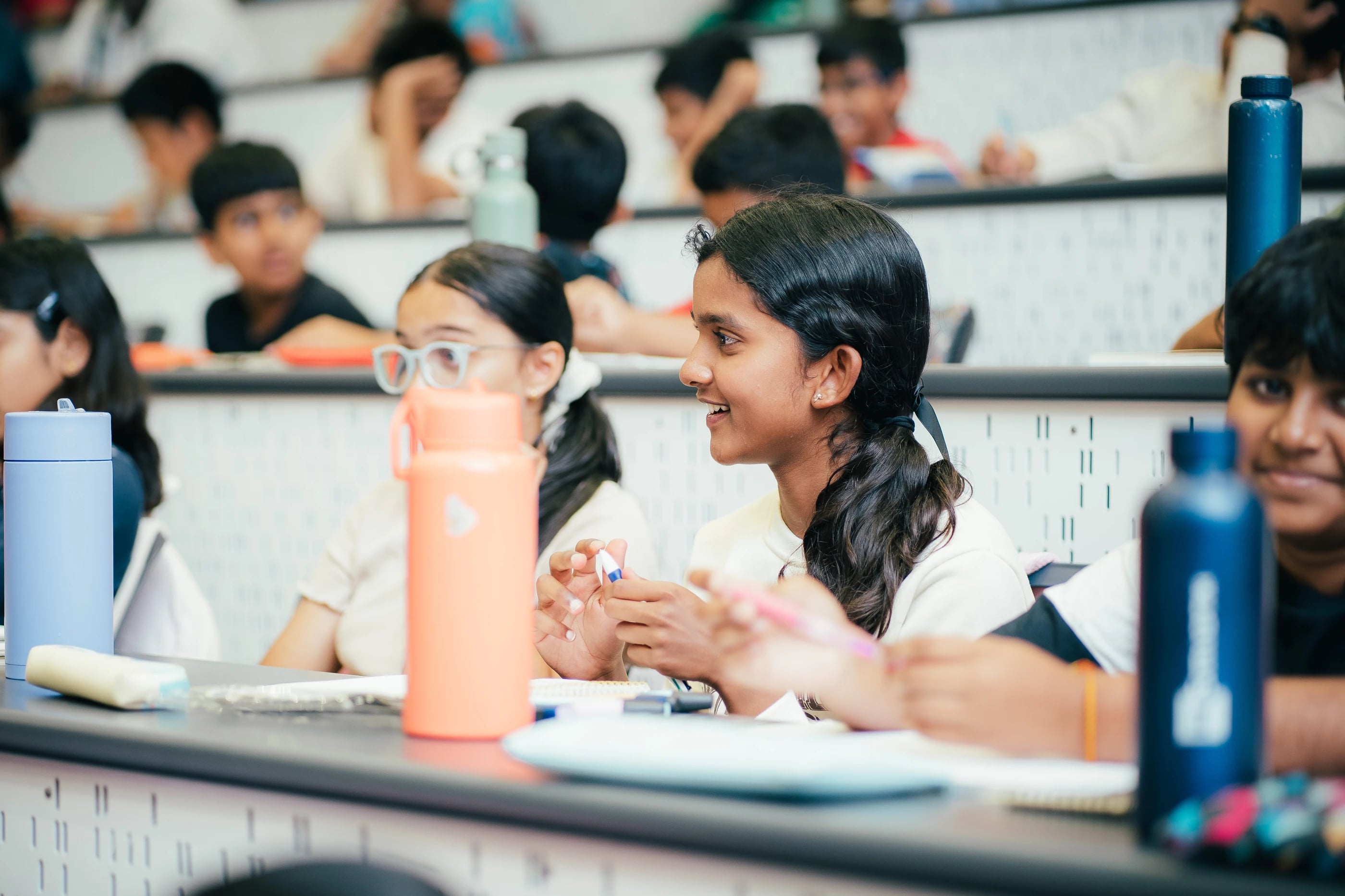 A student smiling and listening during a Loyola lesson